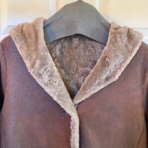 100% Shearling reversible Chocolate Brown and Tan 3/4 length coat.